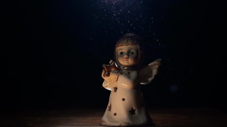 Angel figurine in a ray of light