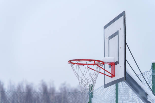istock Outdoors basketball hoop in winter, close up. 1937623182
