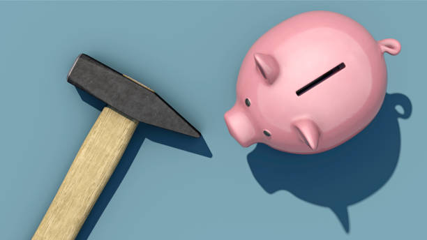 istock Hammer is next to the piggy bank 1937635121
