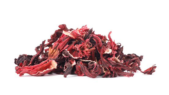 Pile of dry hibiscus tea isolated on white