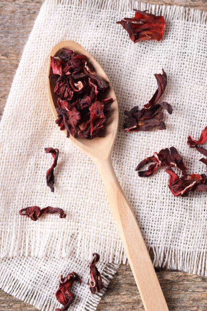istock Spoon with dry hibiscus tea on table, flat lay 1937641462