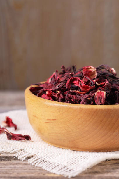 istock Dry hibiscus tea in bowl on table, closeup 1937642011