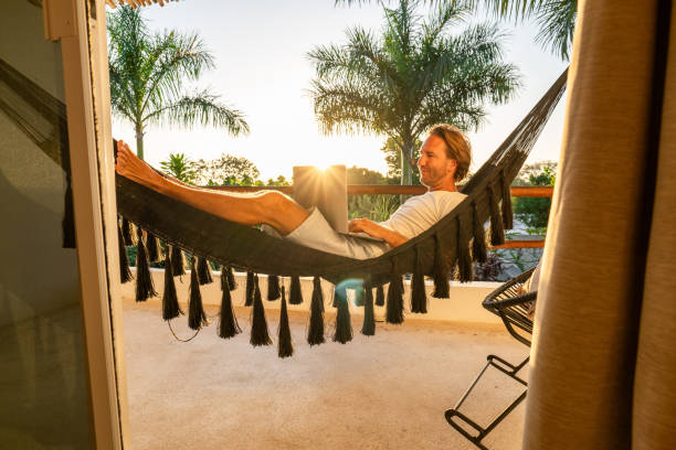 istock Entrepreneur working from hammock at sunrise 1937642557