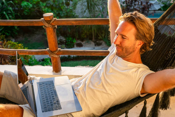istock Entrepreneur working from hammock at sunrise 1937644462