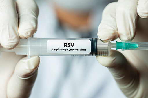 Doctor holding RSV vaccine. RSV: Respiratory Syncytial Virus (Pipeline vaccine.)