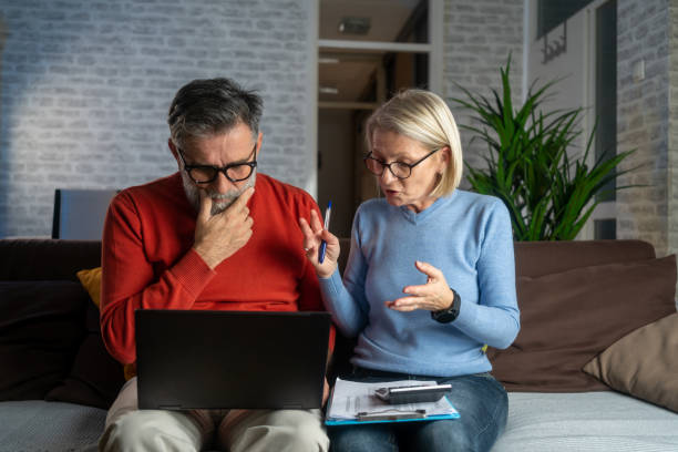 istock Senior couple doing tax return 1937659984