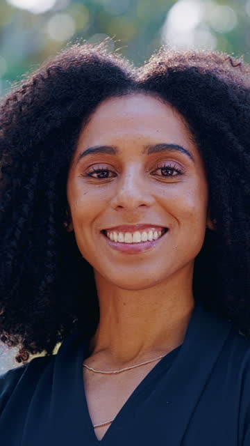 Face, smile and wind with business black woman in city closeup for travel or morning commute to corporate work. Portrait, summer and mindset with confident young professional employee outdoor
