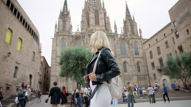 Tourist Woman Explores Gothic Cathedral in Barcelona