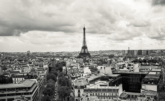 Black and white photo of Paris, France. Aerial view on the Eiffel Tower, Arc de Triomphe, Les Invalides etc.