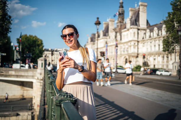 istock Woman using phone in Paris, France 1937685289