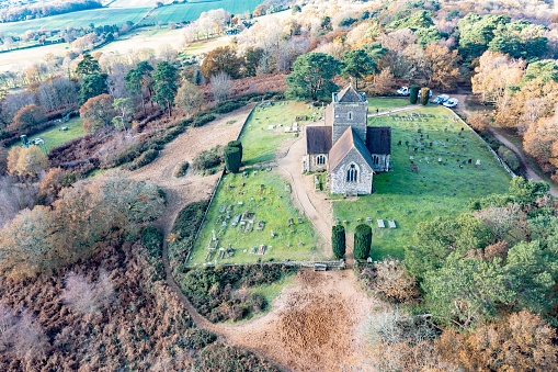 Aerial view of St Martha's Church amazing autumn colours sunny day near Guildford Surrey England Europe