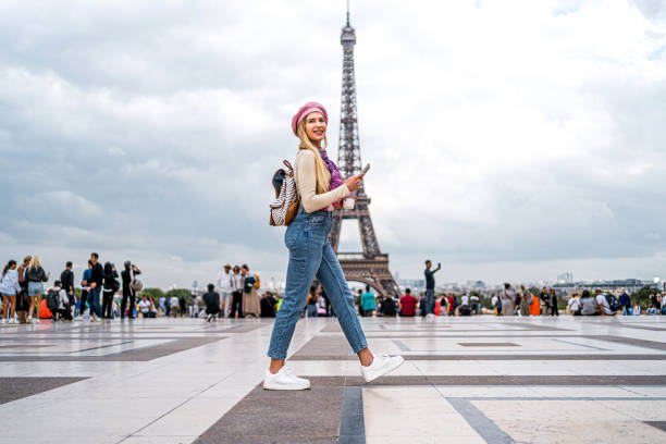 istock Woman in front of the Eiffel Tower in Paris 1937693161