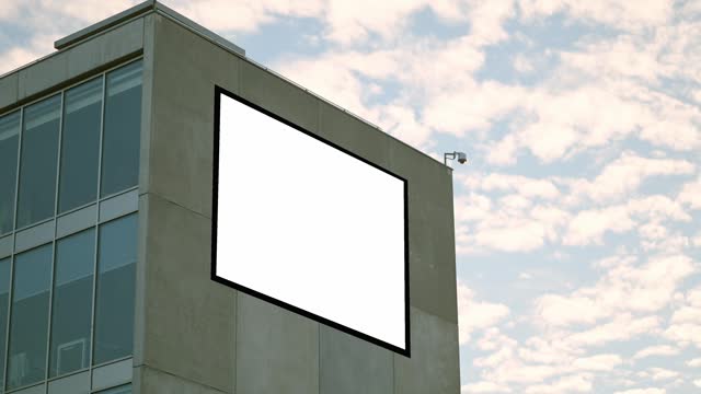 Blank billboard on building facade