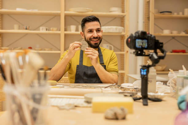 istock ceramics and crafts workshop online class, streaming, vlog young man influencer 1937757746
