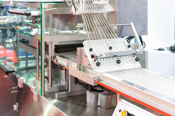 istock close up tablet or capsule feeding chute flow down to blister packaging of automatic continuous blister packing machine in pharmaceutical industrial 1937760397