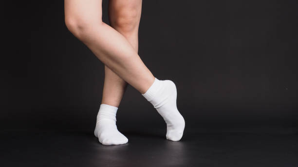 istock Asian Male legs wear white sock on black background. 1937797607