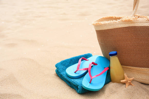 istock Beach accessories, bottle of refreshing drink and starfish on sand, space for text 1937800275