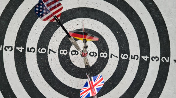 Three darts in the colors of different flags.