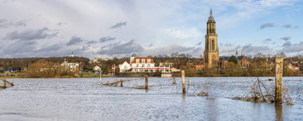 high water levels rhine - grass church flood landscape imagens e fotografias de stock