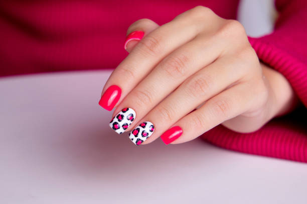 istock Female hand with pink manicure nails 1937810180