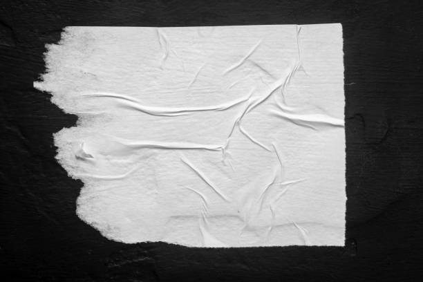 istock White torn poster with folds. 1937810699