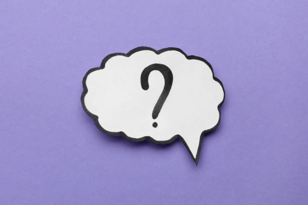 istock Paper speech bubble with question mark on violet background, top view 1937826660