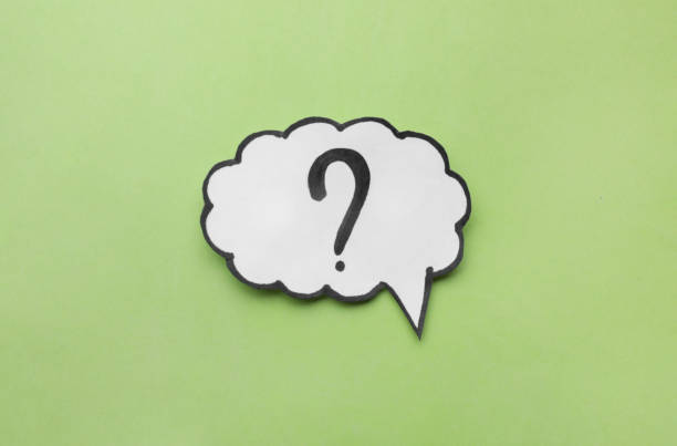 istock Paper speech bubble with question mark on green background, top view 1937826666