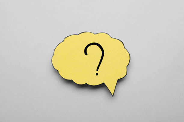istock Paper speech bubble with question mark on light grey background, above view 1937828731