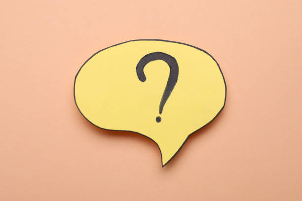 istock Paper speech bubble with question mark on beige background, top view 1937829259