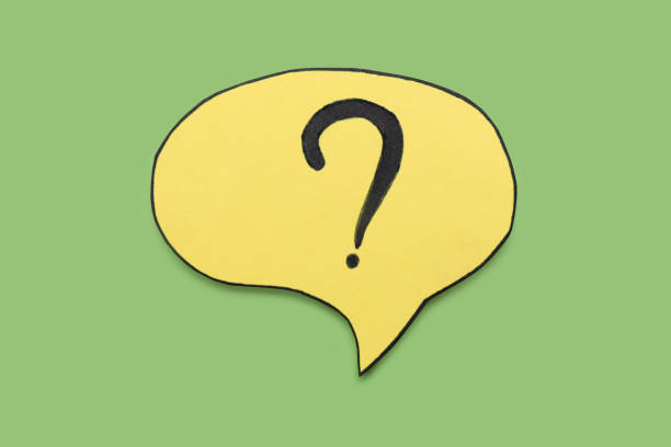 istock Paper speech bubble with question mark on green background, above view 1937829262