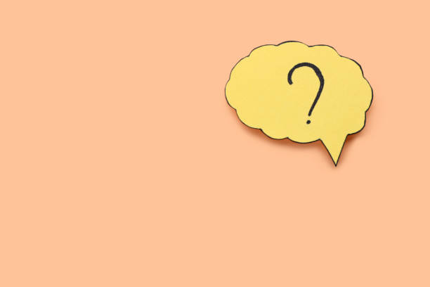 istock Paper speech bubble with question mark on beige background, top view. Space for text 1937829265