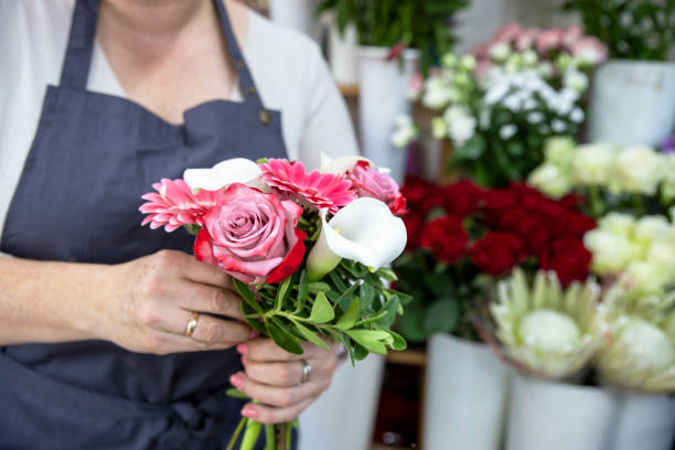 Florist with flower bouquet. Copy space