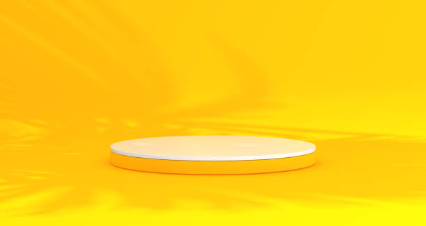 istock White and Yellow Podium for Product Concept on a Yellow Studio Background With Shadow of Palms. Minimal Concept. Summer Time. 1937844923