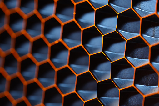Texture of honeycomb grid for reflector as background, macro view
