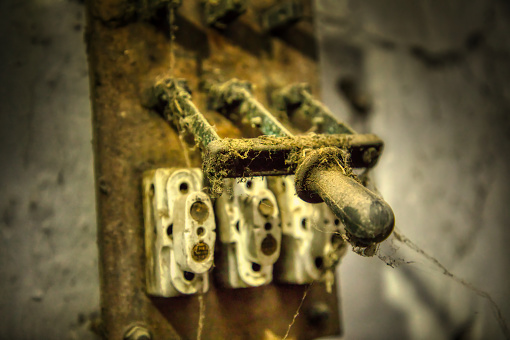 Old power switches for disconnecting the house supply from the mains. Dusty and abandoned. Inspiration from a farmhouse that was demolished and lost in history.