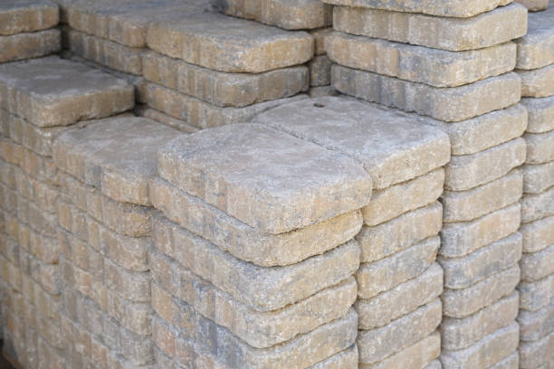 Many concrete blocks are arranged in layers ready for construction.