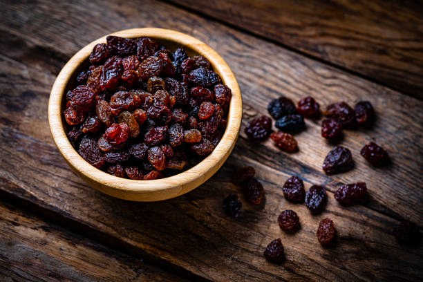 istock Fresh organic raisins in a bowl shot on rustic table 1937959716