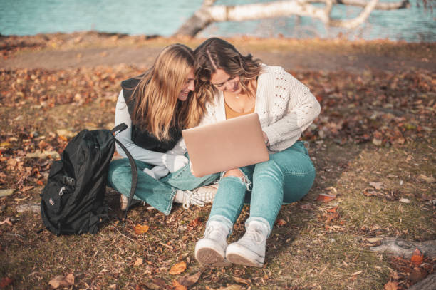 istock Schoolgirls in the park 1937965433