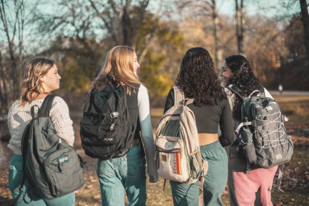 istock Schoolgirls in the park 1937967024