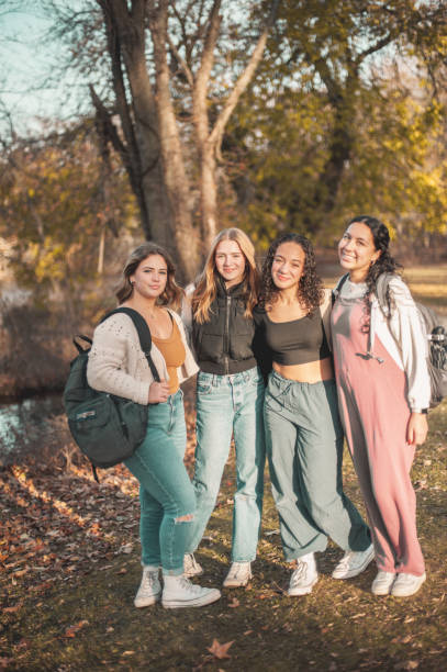 istock Schoolgirls in the park 1937967538