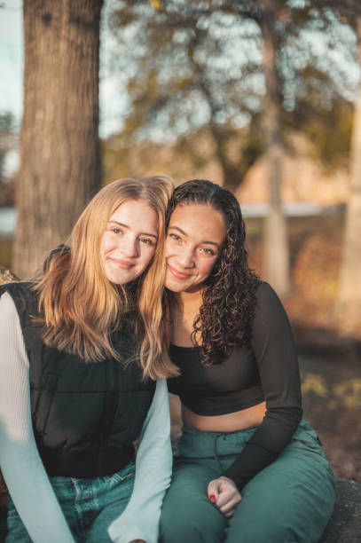 istock Schoolgirls in the park 1937967590
