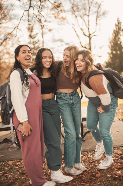 istock Schoolgirls in the park 1937968131