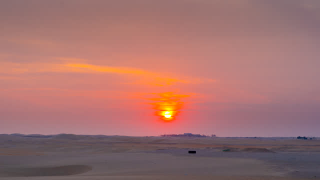 Beautiful dramatic clouds sunset sunrise time lapse over the desert sand dune