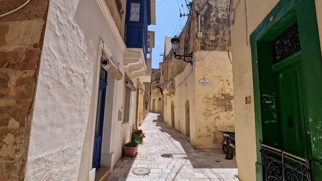 Walking Through Narrow Alley In Victoria On Gozo