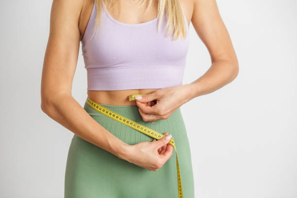 istock Fitness progress measurement with tape measure. Copy space 1937985009