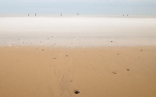 sealine desert or inland sea in qatar where sand dunes meets the ocean.