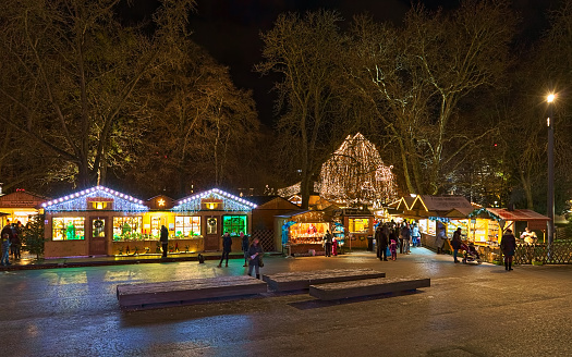Linz, Austria - December 9, 2017: Christmas market in Volksgarten park in night. This Christmas market has been taking place since 1956.