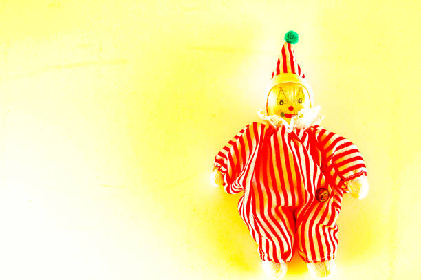 Halloween decorations an evil doll clown starring right at you