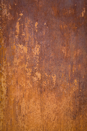 Vertical red and orange rusted metal wall.