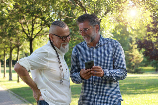 istock Senior friends modern men having fun in nature 1938155762